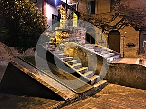 Corinaldo town in the province of Ancona, Marche region, Italy. History, time, stairway and water well photo