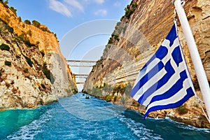 Corinth channel in Greece and greek flag on ship