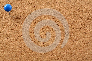 Cork board with blue round pin