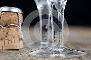 Cork from champagne on a wooden kitchen table. Good New Year's d