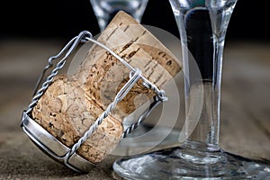 Cork from champagne on a wooden kitchen table. Good New Year's d