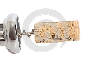 Cork on corkscrew isolated on white