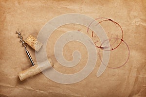 Cork and corkscrew with red wine stains