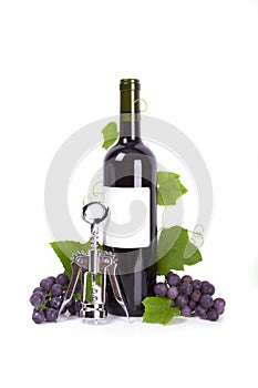 Cork-screw and bottle of red wine with grapes isol