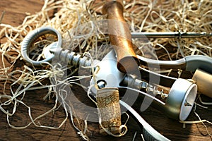 Cork screws laying on oak table