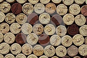 Cork wine bottle tops with numbers of years arranged close to each other. Closeup