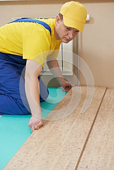 Cork worker at flooring work