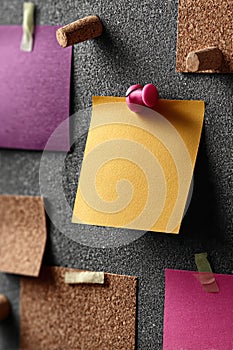 Corkboard with Colorful Notes and Reminders Tacked with Pins and Tape