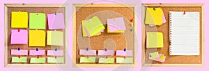 Corkboard or noticeboard with blank colorful sticky notes pad on