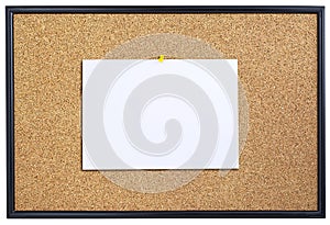 Corkboard with sheet of paper.