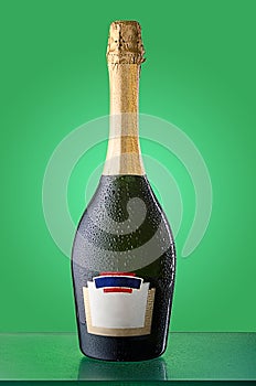 Corked cold bottle of sparkling wine with empty label