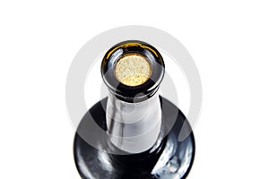 Corked glass bottle of red wine, isolated