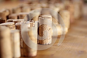 Corks arranged on wooden desk