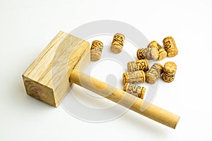 corks and the hammer for corking wine bottles on a white background