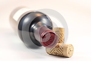 Corks and red wine bottle