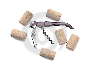 Corkscrew and wine bottle stoppers on white background, top view