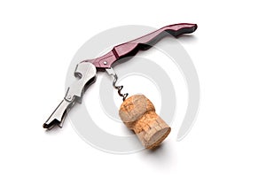 Corkscrew in wine cork isolated on white background