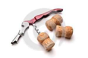 Corkscrew and wine corks isolated on white background