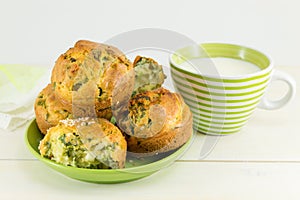 Corn bread with spinach on a wooden table