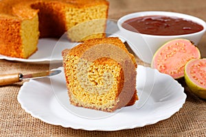 corn cake on white plate on rustic wooden table. Typical Brazilian party food