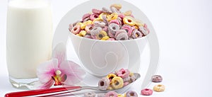 Corn cereal breakfast flake in children cups and milk is a healthy breakfast that is good for your body every day on a white