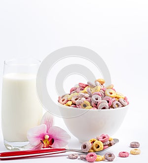 Corn cereal breakfast flake in children cups and milk is a healthy breakfast that is good for your body every day on a white