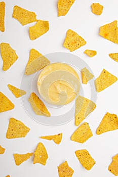 corn chips nachos with sauce and chili isolated on white background