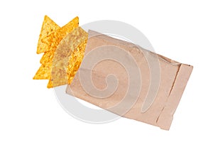 Corn chips or nachos  spill out of the small package  isolated on white background top view