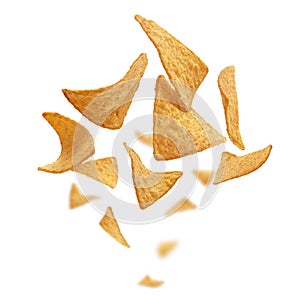 Corn chips of triangular shape levitate on a white background