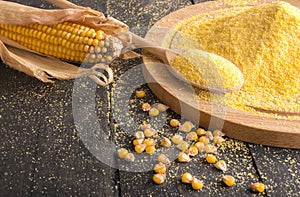 Corn cob and flour spread on table