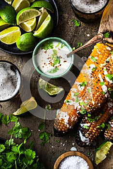 Corn cobs grilled, served with beer,salt, coriander and lime