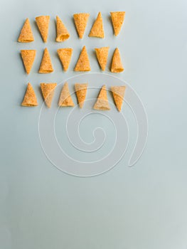 Corn cones pattern on green background