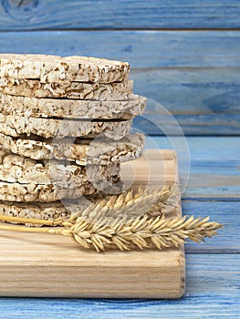 Corn crackers on a blue wooden table.