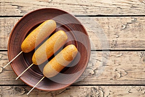 Corn dog traditional American corndog street junk food deep fried hot meat sausage snack