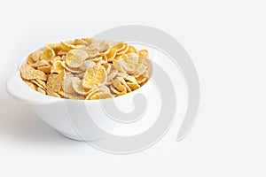 Corn flake in bowl on white background, healthy breakfast concept