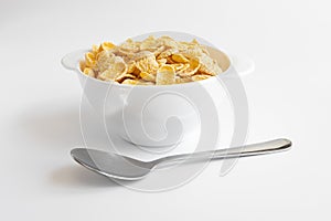 Corn flake in bowl on white background, healthy breakfast concept