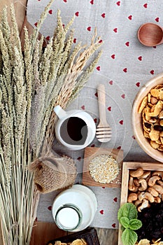 Corn flake with currant dried fruit , cashew nuts and milk.