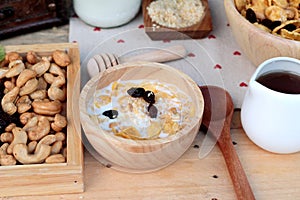 Corn flake with currant dried fruit ,cashew nuts and milk.