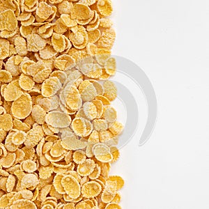 Corn flakes background, frame of cornflakes on white