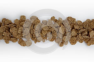 Corn flakes background, frame of cornflakes on white