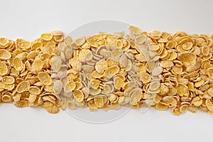 Corn flakes background, frame of cornflakes on white