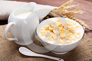 Corn flakes in bowl with milk