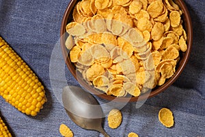 Corn flakes in a bowl on the table. Corn flakes background and texture
