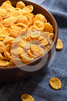 Corn flakes for breakfast in a bowl, close-up