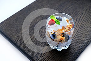 Corn flakes with fresh berries and mint leaf