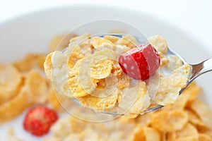 Corn flakes, milk, strawberries