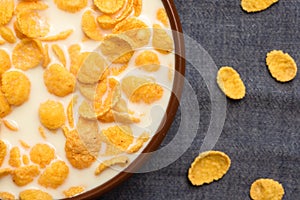 Corn flakes with tar in a bowl close-up. Top view