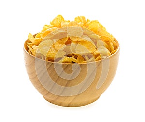 Corn flakes in wood bowl on white background