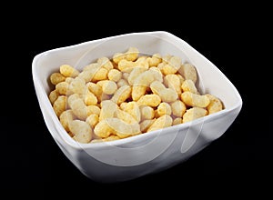 Corn flips in a white bowl photo