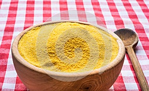 Corn flour in a wooden bowl